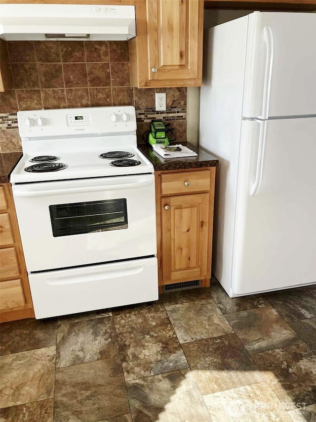 778 Elma Mccleary Rd Unit 20, Mccleary, WA 98557 - kitchen with white appliances, exhaust hood, dark countertops, and backsplash