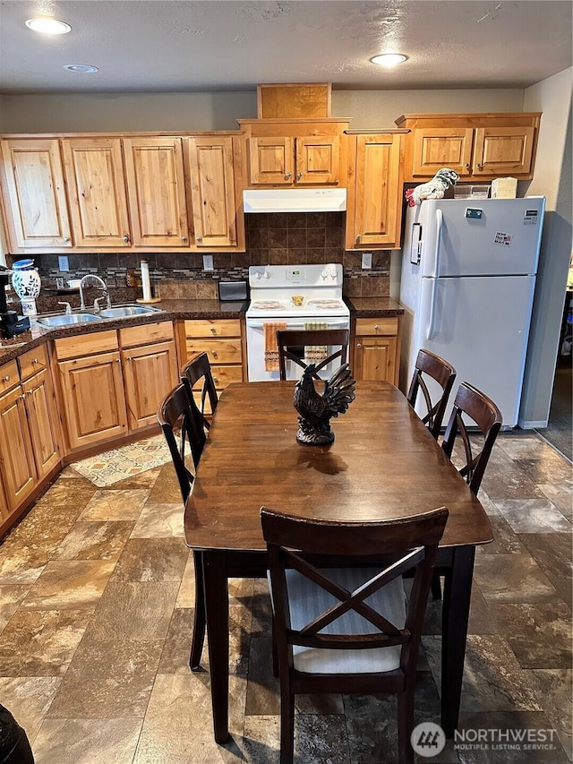 778 Elma Mccleary Rd Unit 20, Mccleary, WA 98557 - kitchen featuring white appliances, under cabinet range hood, backsplash, and stone finish floors