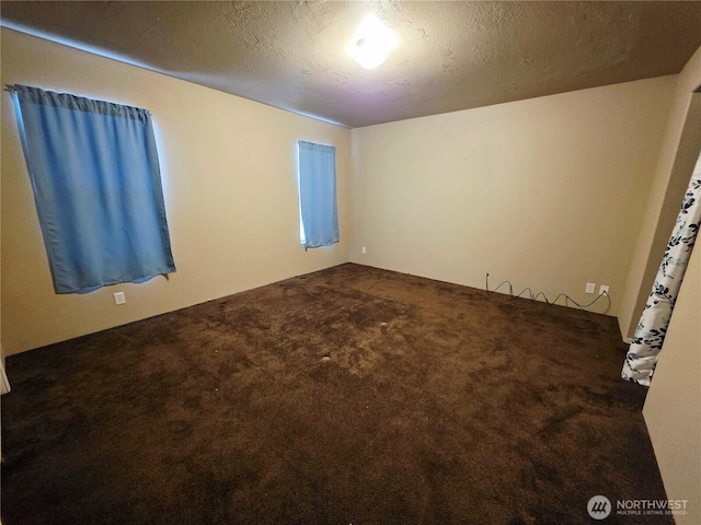 778 Elma Mccleary Rd Unit 20, Mccleary, WA 98557 - empty room featuring dark carpet and a textured ceiling