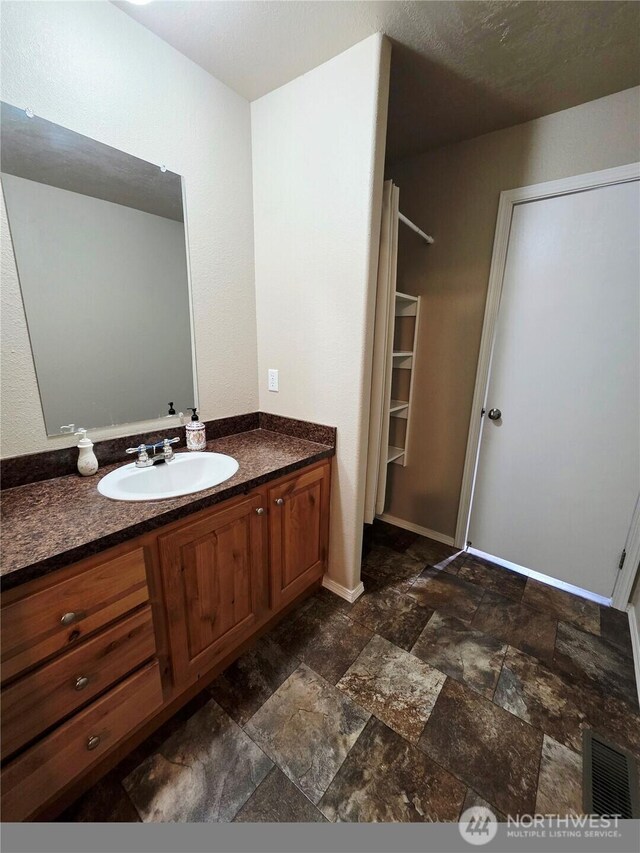 778 Elma Mccleary Rd Unit 20, Mccleary, WA 98557 - bathroom featuring vanity and stone finish floors