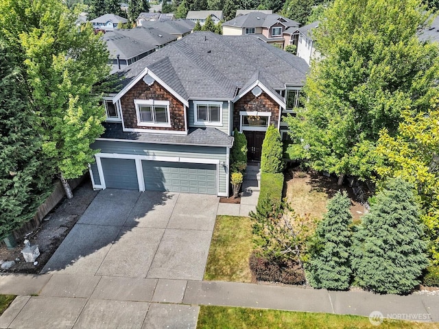4021 220th St SE, Bothell, WA 98021 - view of front of home featuring a garage, driveway, and a shingled roof