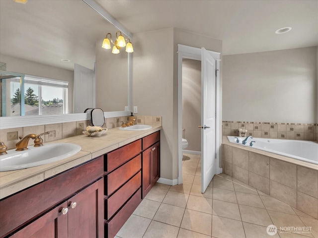 4021 220th St SE, Bothell, WA 98021 - bathroom with double vanity, a garden tub, and tile patterned flooring