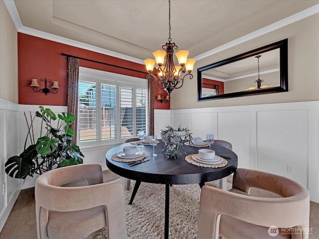 4021 220th St SE, Bothell, WA 98021 - carpeted dining space with crown molding, a decorative wall, a chandelier, a wainscoted wall, and a tray ceiling