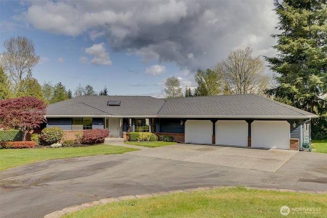 7617 160th St SE, Snohomish, WA 98296 - ranch-style home with brick siding, asphalt driveway, an attached garage, and covered porch
