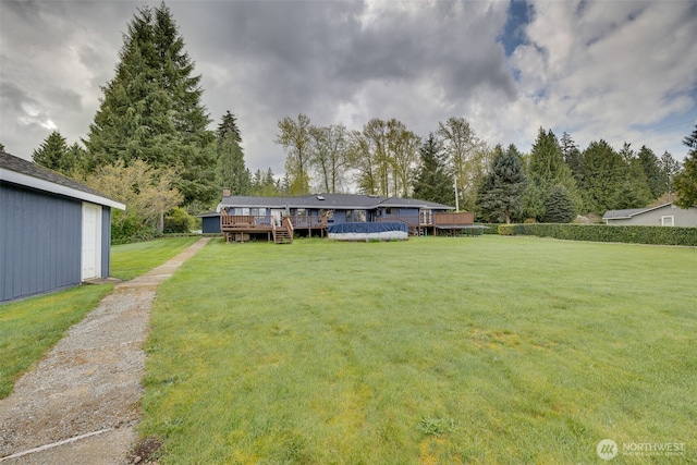 7617 160th St SE, Snohomish, WA 98296 - view of green lawn featuring a deck and a covered pool