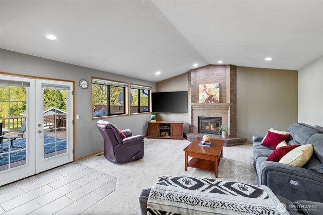 7617 160th St SE, Snohomish, WA 98296 - living area featuring french doors, vaulted ceiling, recessed lighting, light colored carpet, and a brick fireplace