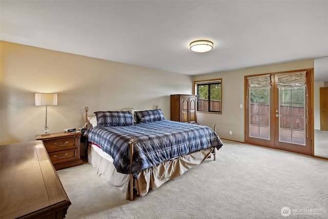 7617 160th St SE, Snohomish, WA 98296 - bedroom with access to exterior, light colored carpet, and french doors