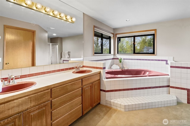 7617 160th St SE, Snohomish, WA 98296 - full bath featuring double vanity, healthy amount of natural light, a garden tub, and tile walls