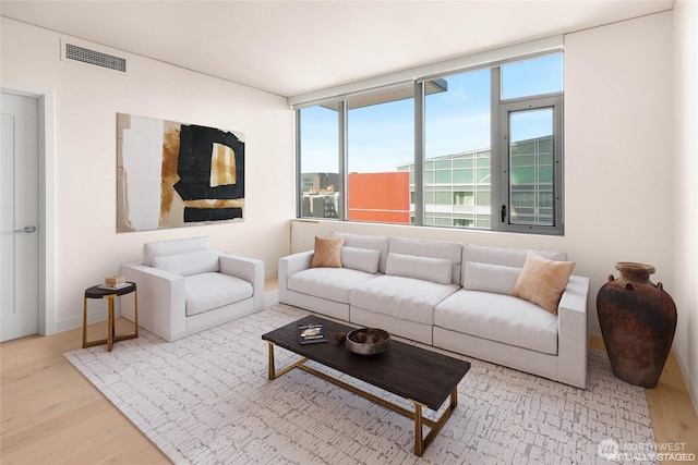 2510 6th Ave Unit 809, Seattle, WA 98121 - living room with wood finished floors and baseboards