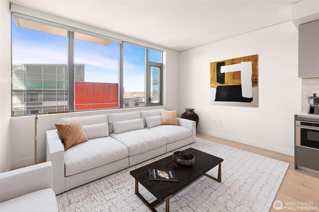 2510 6th Ave Unit 809, Seattle, WA 98121 - living room with wood finished floors and baseboards