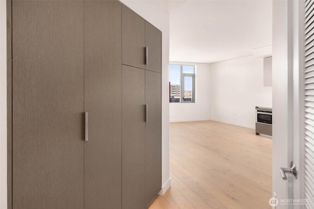2510 6th Ave Unit 809, Seattle, WA 98121 - corridor featuring light wood finished floors and baseboards