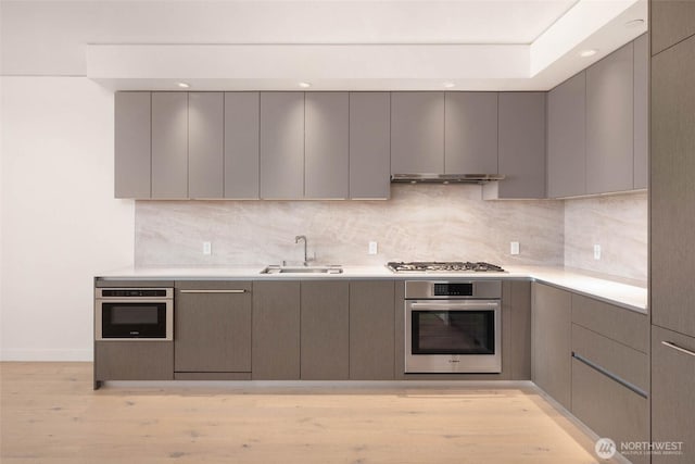 2510 6th Ave Unit 809, Seattle, WA 98121 - kitchen with stainless steel appliances, modern cabinets, gray cabinetry, and recessed lighting