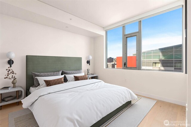 2510 6th Ave Unit 809, Seattle, WA 98121 - bedroom with wood finished floors and baseboards