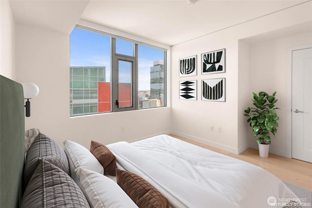 2510 6th Ave Unit 809, Seattle, WA 98121 - bedroom with wood finished floors and baseboards