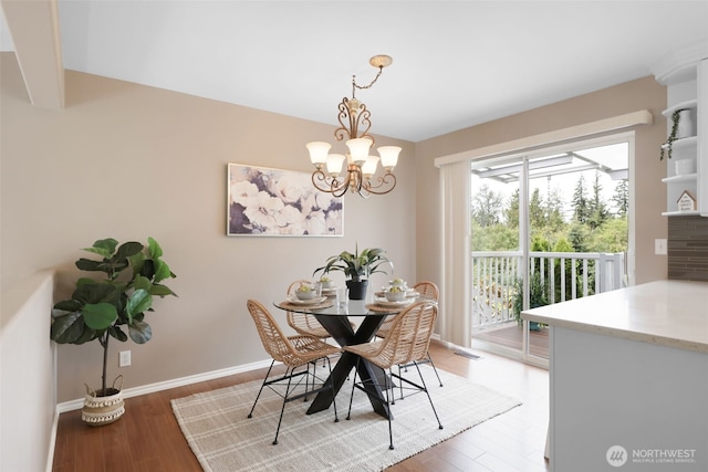 5908 3rd Dr W, Everett, WA 98203 - dining space featuring light wood finished floors, a chandelier, and beamed ceiling