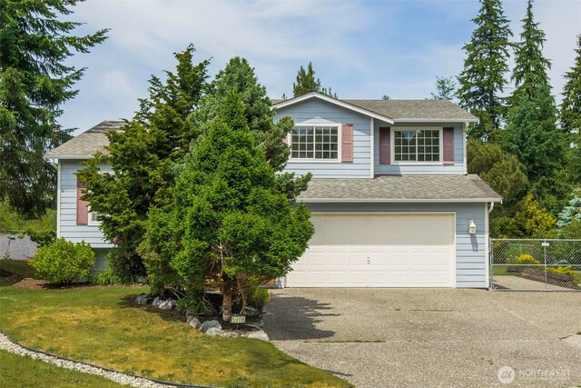 5908 3rd Dr W, Everett, WA 98203 - view of front of house with concrete driveway, an attached garage, and a shingled roof