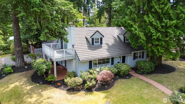 3706 84th Ave SE, Mercer Island, WA 98040 - view of front of property with a front lawn, stucco siding, a wooden deck, and a chimney