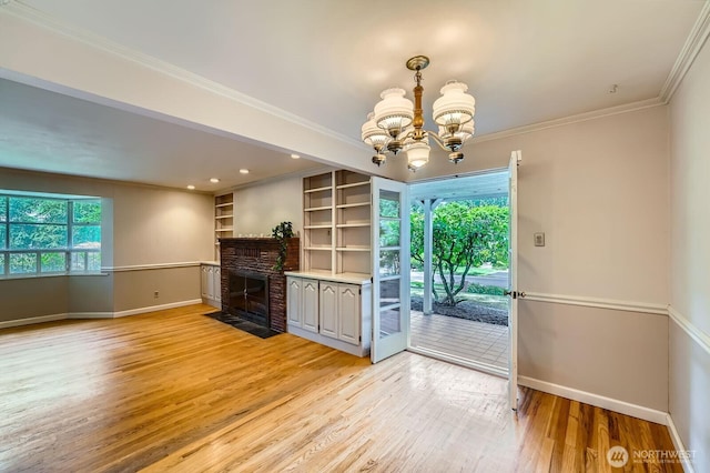 3706 84th Ave SE, Mercer Island, WA 98040 - unfurnished living room featuring a chandelier, light wood-type flooring, ornamental molding, a fireplace with flush hearth, and recessed lighting