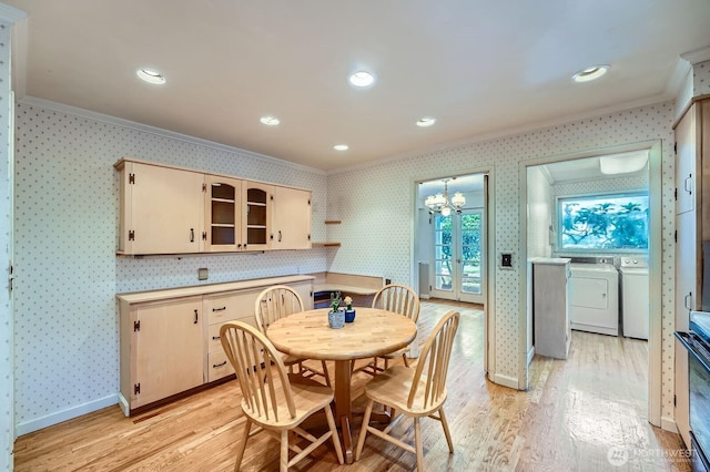 3706 84th Ave SE, Mercer Island, WA 98040 - dining area with crown molding, washing machine and dryer, wallpapered walls, light wood-style floors, and a chandelier