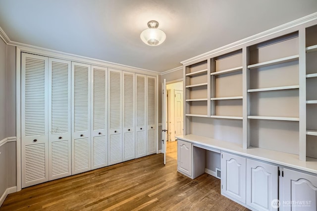 3706 84th Ave SE, Mercer Island, WA 98040 - unfurnished office featuring built in desk, wood finished floors, and ornamental molding