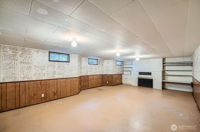 3706 84th Ave SE, Mercer Island, WA 98040 - basement featuring a fireplace, wooden walls, and a wainscoted wall
