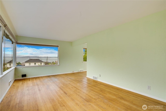 2602 Mccarver St, Tacoma, WA 98403 - unfurnished room with wood finished floors and baseboards