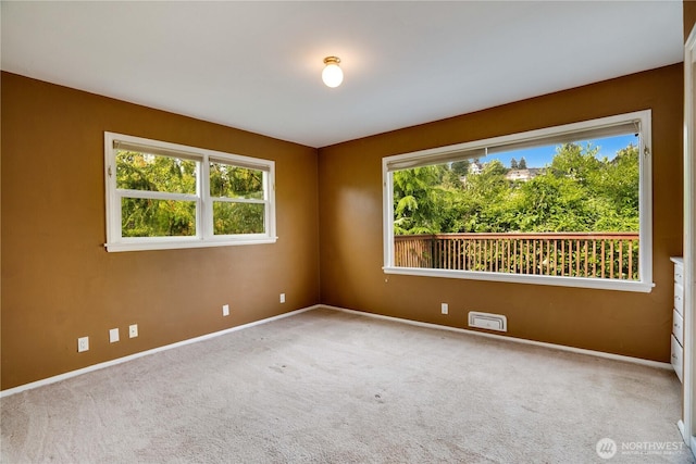 2602 Mccarver St, Tacoma, WA 98403 - unfurnished room featuring healthy amount of natural light and carpet