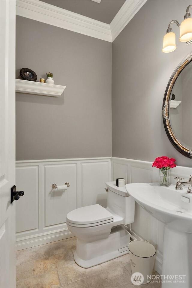 67 Cascade Ky, Bellevue, WA 98006 - half bathroom with crown molding, a decorative wall, and a wainscoted wall