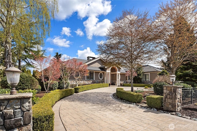 67 Cascade Ky, Bellevue, WA 98006 - view of front of home featuring stone siding and curved driveway
