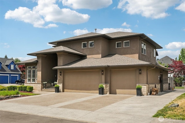 4706 NE 137th St NE, Vancouver, WA 98686 - prairie-style house featuring concrete driveway, stucco siding, an attached garage, roof with shingles, and a gate