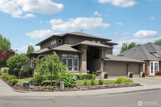 4706 NE 137th St NE, Vancouver, WA 98686 - prairie-style house featuring a garage, stucco siding, concrete driveway, and a shingled roof