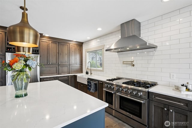 4706 NE 137th St NE, Vancouver, WA 98686 - kitchen with wall chimney range hood, stainless steel appliances, decorative backsplash, recessed lighting, and dark wood-style floors