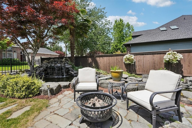 4706 NE 137th St NE, Vancouver, WA 98686 - fenced backyard featuring an outdoor fire pit and a patio area