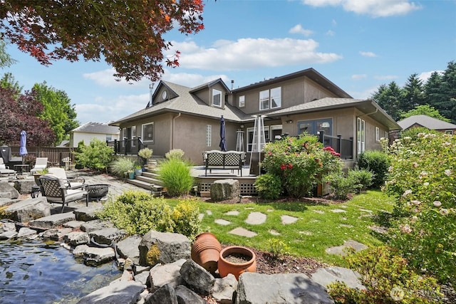 4706 NE 137th St NE, Vancouver, WA 98686 - back of house featuring an outdoor fire pit, a patio, and stucco siding