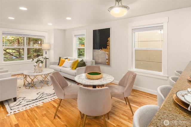 5235 11th Ave NE Unit A, Seattle, WA 98105 - dining space featuring light wood-style flooring, healthy amount of natural light, and recessed lighting