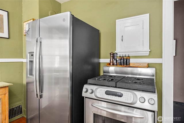 4228 1st Ave NE, Seattle, WA 98105 - kitchen featuring stainless steel appliances and white cabinets