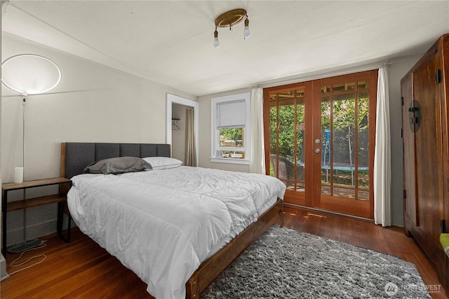 4228 1st Ave NE, Seattle, WA 98105 - bedroom with french doors, wood finished floors, and access to outside
