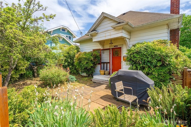 4228 1st Ave NE, Seattle, WA 98105 - shotgun-style home with a chimney and a shingled roof