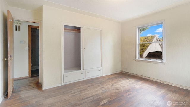 4125 W F St, Bremerton, WA 98312 - unfurnished bedroom featuring light wood finished floors and a closet