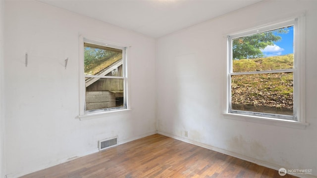 4125 W F St, Bremerton, WA 98312 - spare room featuring healthy amount of natural light and wood finished floors