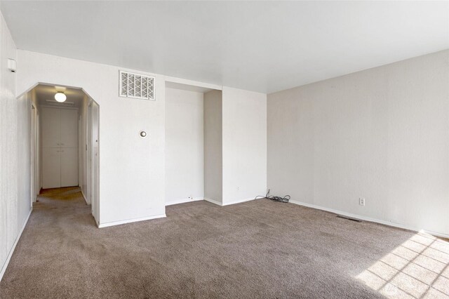 832 S 2nd Ave, Othello, WA 99344 - carpeted spare room with arched walkways and baseboards