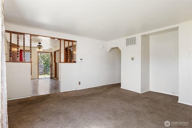 832 S 2nd Ave, Othello, WA 99344 - carpeted spare room with ceiling fan and arched walkways