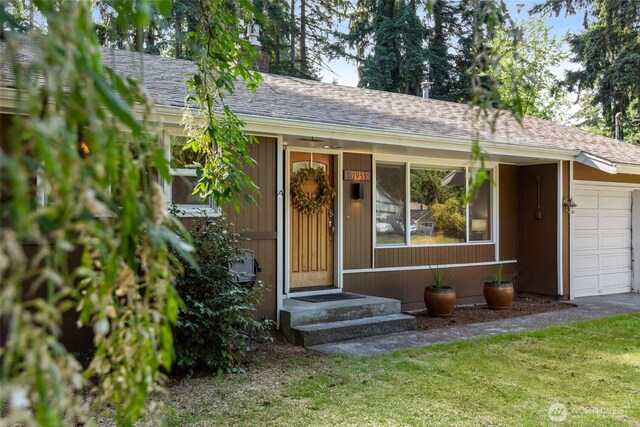 19515 7th Ave NE, Shoreline, WA 98155 - view of front of property with a garage, roof with shingles, a chimney, and a front yard