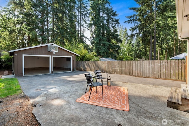 19515 7th Ave NE, Shoreline, WA 98155 - view of patio / terrace with a garage and an outbuilding