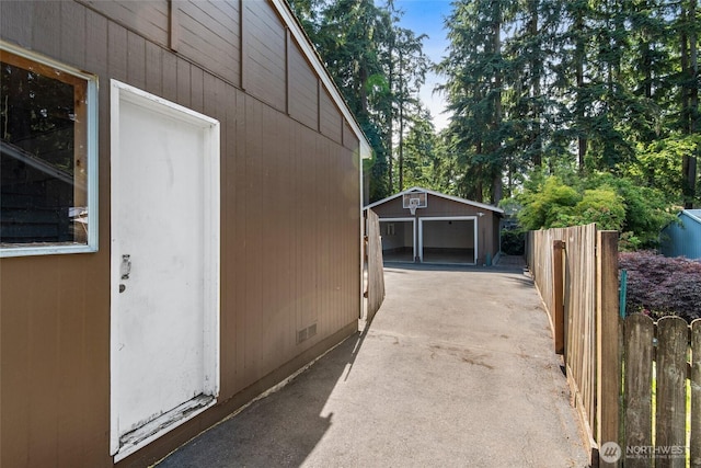 19515 7th Ave NE, Shoreline, WA 98155 - view of property exterior with an outbuilding, a garage, and crawl space