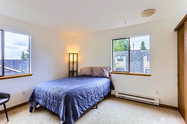 8605 244th St SW Unit 3F, Edmonds, WA 98026 - carpeted bedroom featuring a baseboard heating unit and baseboards
