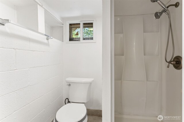4952 12th Ave S, Seattle, WA 98108 - bathroom with a shower and concrete block wall