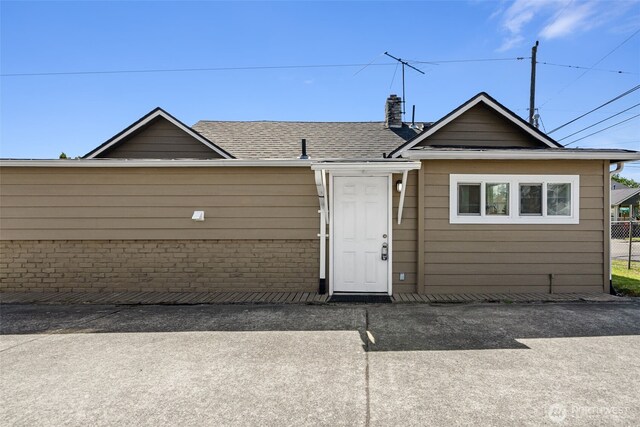 4952 12th Ave S, Seattle, WA 98108 - view of front facade featuring roof with shingles