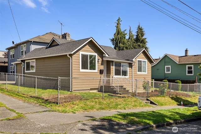 4952 12th Ave S, Seattle, WA 98108 - view of front of property with roof with shingles and a chimney