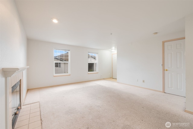 1160 Monroe Ave NE Unit B-4, Renton, WA 98056 - unfurnished living room with carpet floors and a tiled fireplace